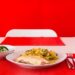 Putenschnitzel mit Käse und Schinken überbacken und Petersilienerdäpfel